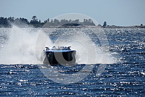 Speed boat racing on the water