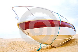 Speed boat resting on a beach