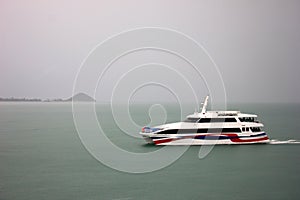 Speed boat sailing in fog, rain,Travel and transportation.