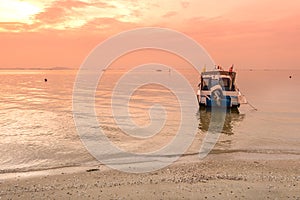 Speed boat on a sunset background