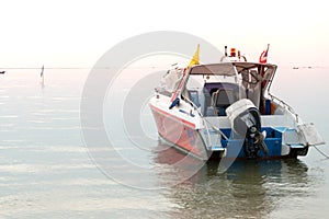 Speed boat on a sunset background