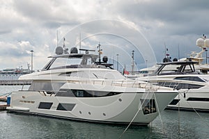 Speed boats at harbor. Power boats moored in marina. Sea coast pier