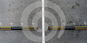 speed bump of black and yellow colours located on road