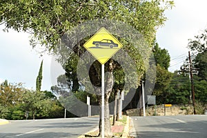 Speed bump road sign on city street