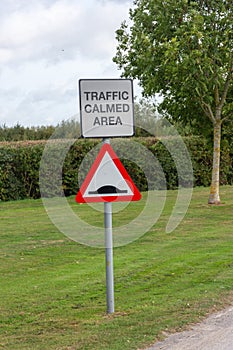 Speed bump warning road sign