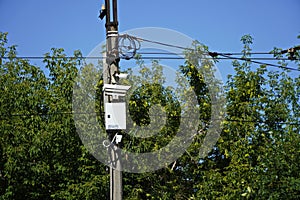 speed camera surveillance on the road. Concrete pillar, blue sky background, free space for text, bottom view