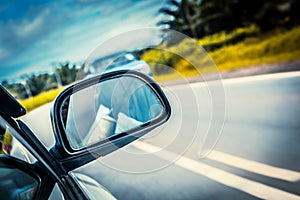 Speed car driving at high speed on empty road