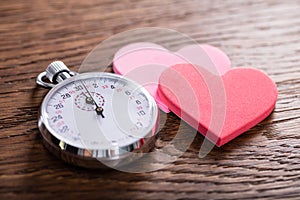 Speed Dating Concept. Hearts And A Stop Watch