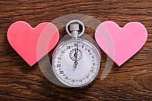 Speed Dating Concept. Hearts And A Stop Watch photo