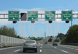 speed detector and payment of the motorway vignette with road signs with indications of many locations in Switzerland photo