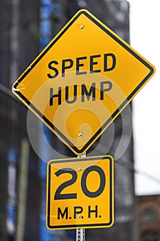 Speed hump ahead warning,20 M.P.H. sign photo