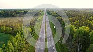 Speed Intercity Highway Through Forest With Moving Cars And Trucks Aerial View