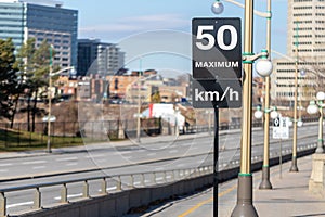Speed limit road sign in the street, 50 km per hour maximum in Ottawa city, Canada.