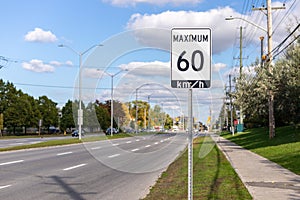 Speed limit road sign in the street, 60 km maximum in Ottawa, Canada