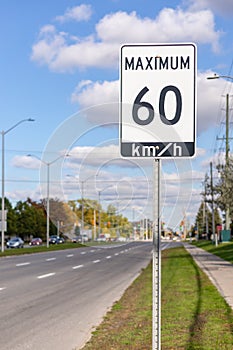 Speed limit road sign in the street, 60 km maximum in Ottawa, Canada