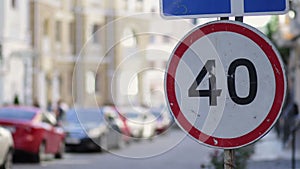 Speed limit sign in the city street on summer day