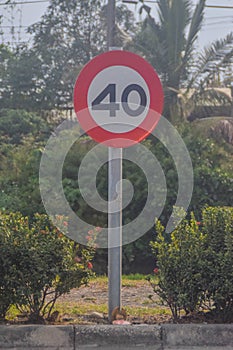 A speed limit sign beside the road