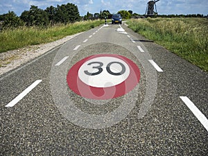 Speed limit sign on the road