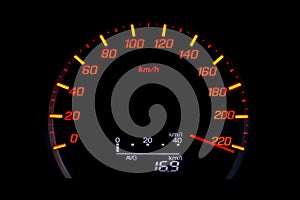 Close up of car speedometer with the needle pointing a high speed at blackgroun photo