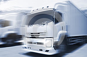 Speed Motion Blur of Cargo Trucks Driving on The Road. Industry Road Freight Truck. Logistic and Cargo Transport concept.