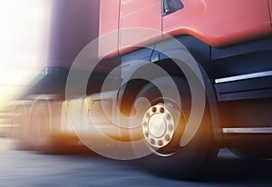 Speed Motion Blur of Semi Truck Driving on The Road. Truck Wheels Spininng. Industry Road Freight Truck. Logistics Transportation.