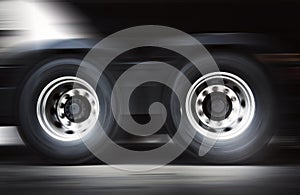 Speed Motion Blur of Semi Truck Wheels Spininng. Truck Driving on The Road. Industry Freight Truck Transport.