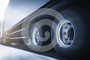 Speed motion blur of trailer truck driving on road. Business loistics. Cargo freight truck transportation.