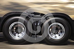 Speed motion wheels spin of semi truck. Metal chrome wheel. truck tires.