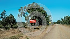 Speed Reduction Sign On Outback Highway