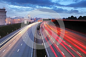 Speed Traffic at Dramatic Sundown Time - light trails on motorwa