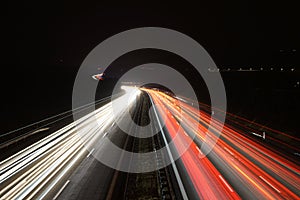 Speed Traffic - light trails on motorway highway at night.