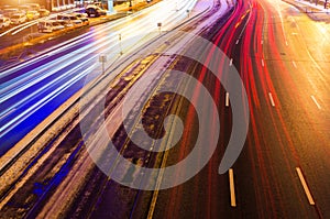 Speed Traffic light trails on motorway highway at night, long exposure abstract urban background.