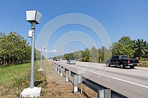 Speed trap surveillance camera along highway to control speeding