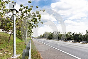 Speed trap surveillance camera along highway to control speeding