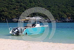 Speedboat for fishing is moored on the beach at Koh Samui