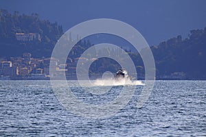 Speedboat with hydrofoil, goes over Lake Como, in Italy