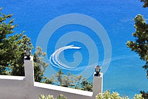 The speedboat makes a U-turn. in the azure waters of the Mediterranean Sea.