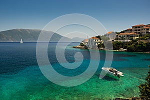 Speedboat moored in turquoise bay Kephalonia