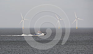 Speedboat and windfarms