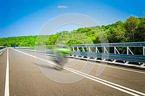 Speeding bike on a straight road