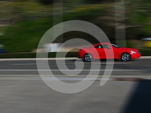 Speeding Blurred motion red car