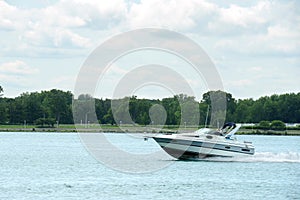 speeding cabin cruiser on the st clair river ontario