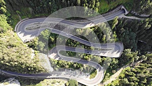 Speeding car on curvy forest road