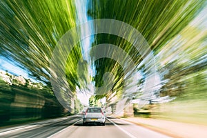 Speeding Car On A Highway, Country Asphalt Road. Motion Blur Background