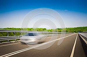A speeding car on a motorway