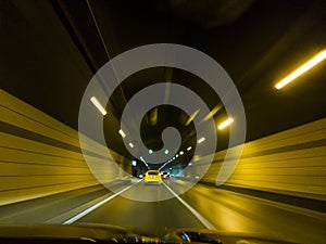 Speeding Cars Inside A Highway Urban Tunnel Motion Blur Background.