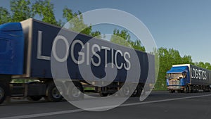 Speeding freight semi truck with LOGISTICS caption on the trailer. Road cargo transportation. 3D rendering