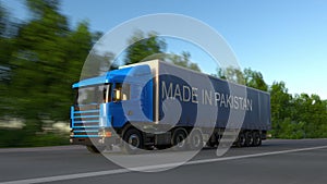 Speeding freight semi truck with MADE IN PAKISTAN caption on the trailer. Road cargo transportation. 3D rendering