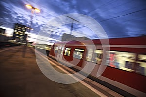 speeding passenger train in the evening