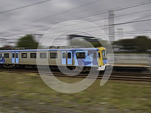 Speeding Passenger Train moving through Station in Sydney CBD NSW Australia